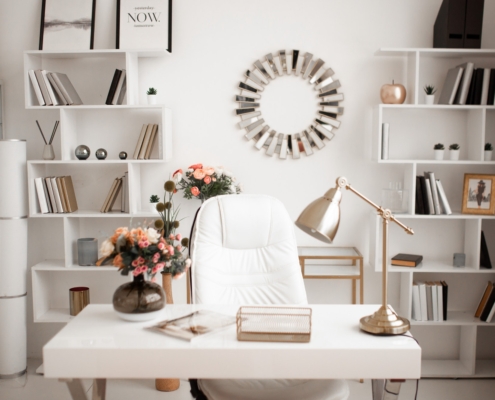home office in light shades and colors white desk chair white book shelves