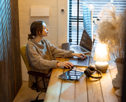 woman works from cozy home office